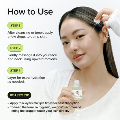 Beauty of Joseon Calming Barrier Serum 30ml in use: model holding the bottle and applying serum drops to her face