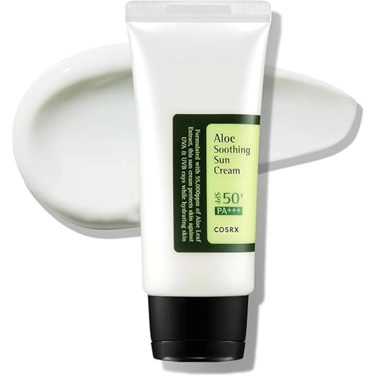 White tube of COSRX Aloe Soothing Sun Cream SPF 50+ PA+++ with a green label stating it is formulated with 55,000ppm of Aloe Leaf Extract, standing in front of a smeared white cream swatch